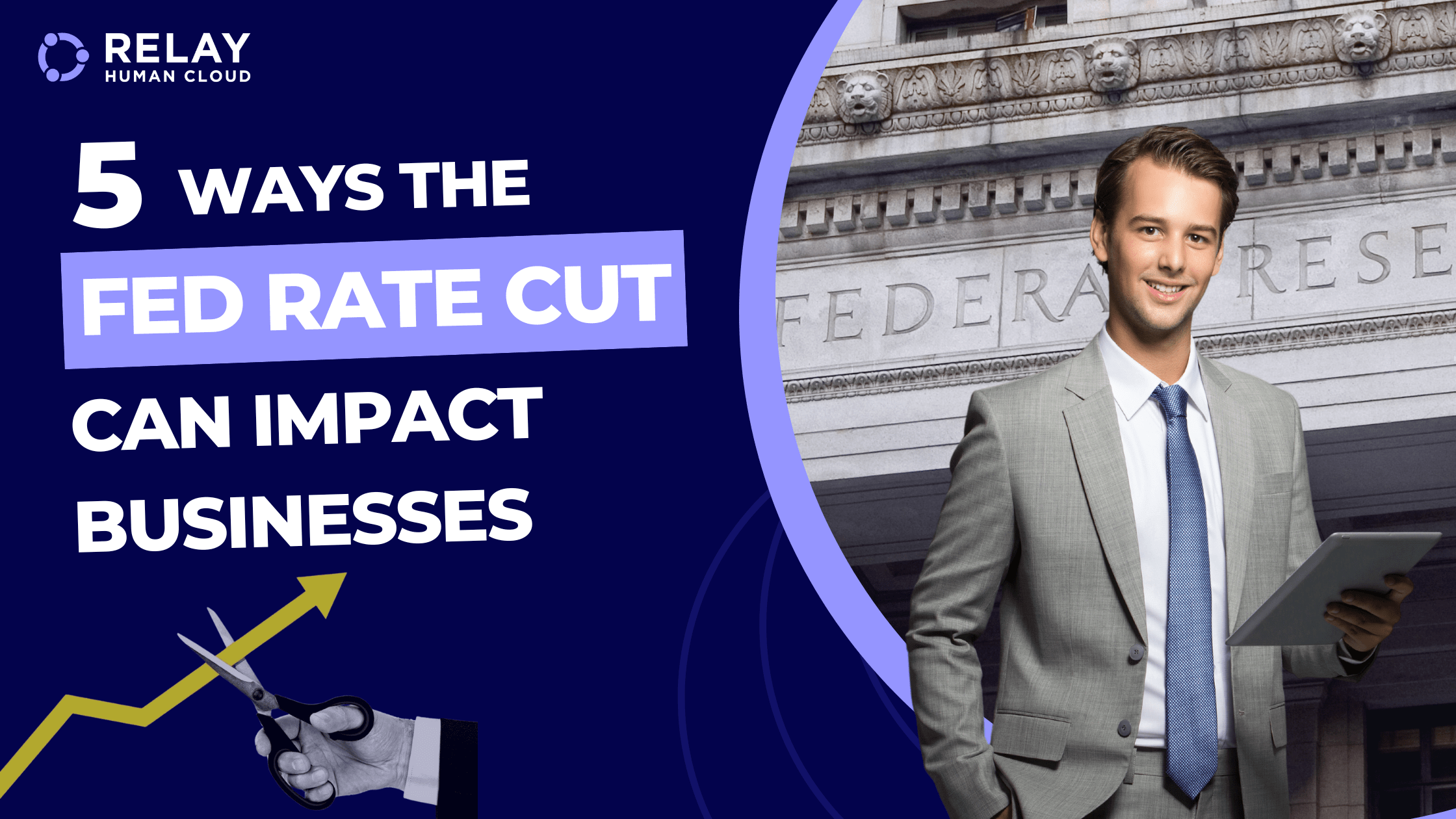 Man in a grey suit and blue tie standing in front of the federal reserve building.