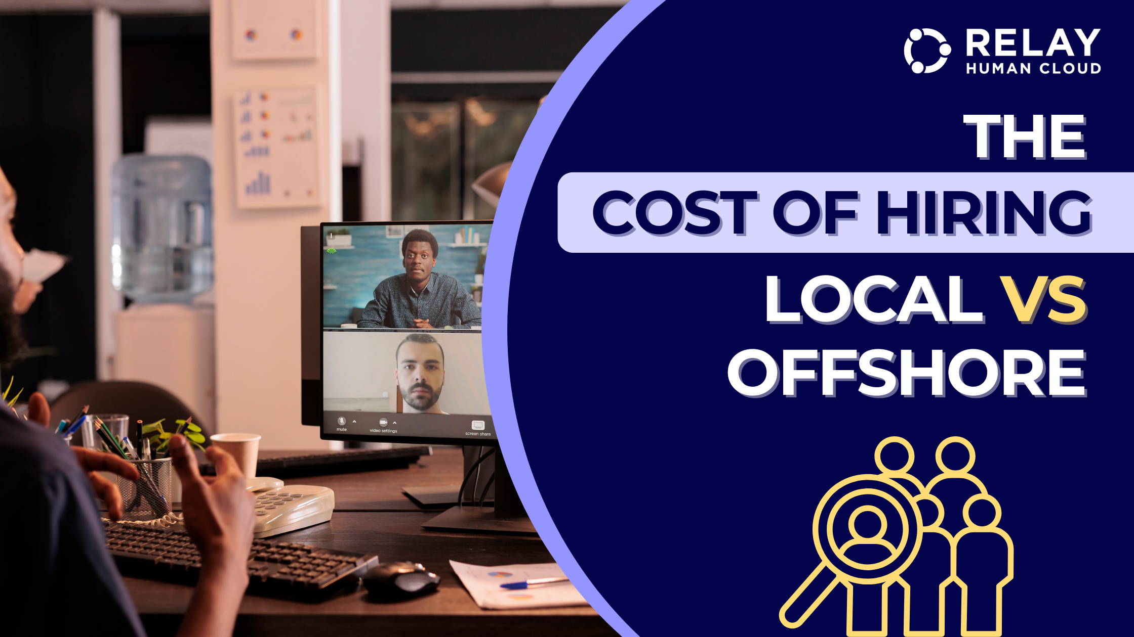 Person on a video call talking to two other people on the screen. The person is sitting in an office with a keyboard, mouse, and screen in from of him.